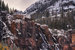 Snow around Bridal Veil Falls and the historic power plant near Telluride