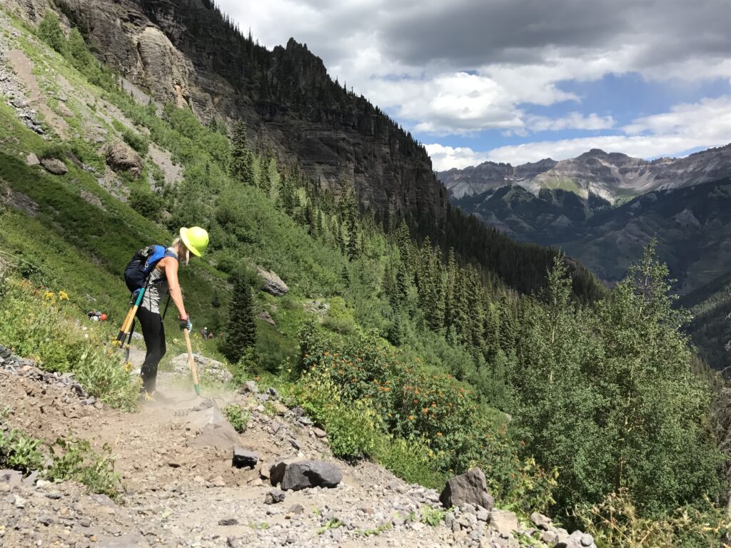 Person doing trail work for Telluride Mountain Club